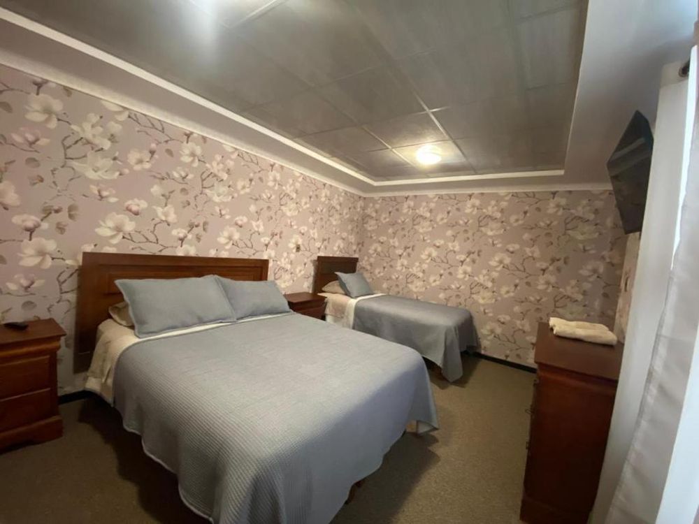 Premium room in the Florencia wing with a double bed and a single bed